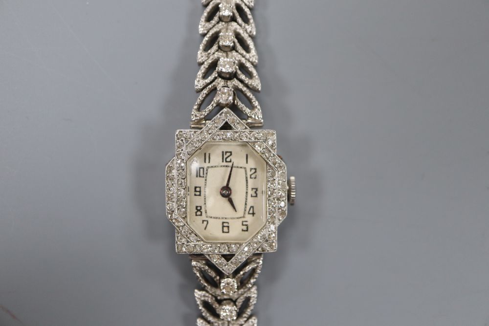 A ladys 18ct white gold and diamond set cocktail watch with diamond set bracelet, length 16cm, gross 33.3 grams.